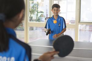 students playing table tennis